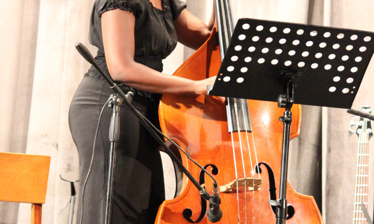 Catherine Karuri playing the double bass.