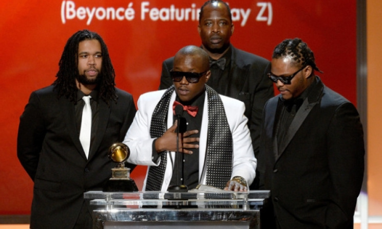 Brian Soko (in white) gives his Grammy acceptance speech.