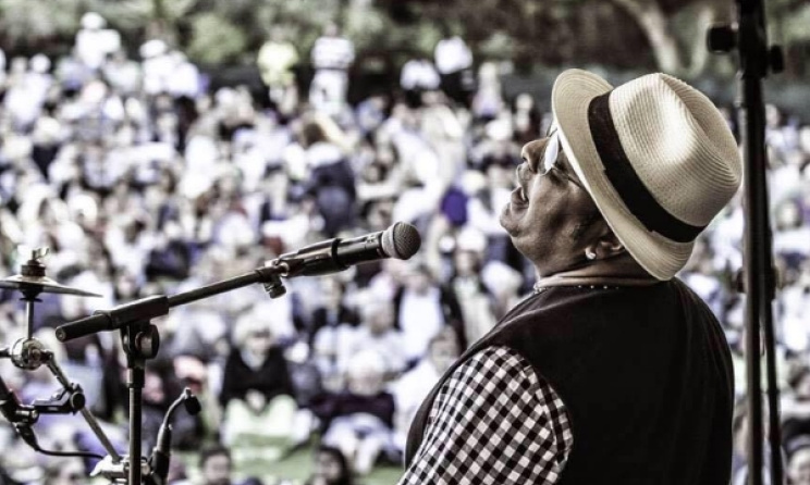 John Hassan on stage. Photo: Facebook
