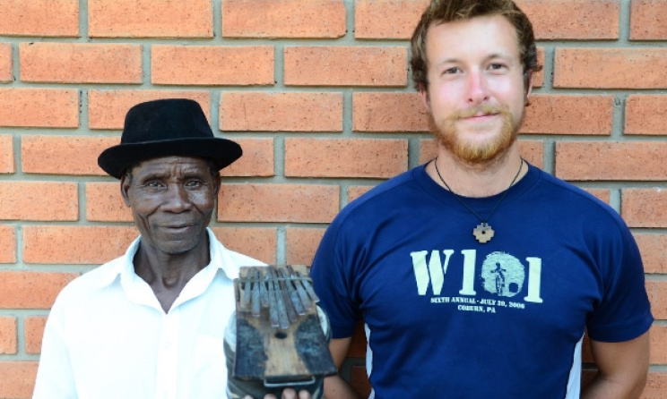 Mbira player Mohale with CM founder Alex Paullin. Photo: Facebook.
