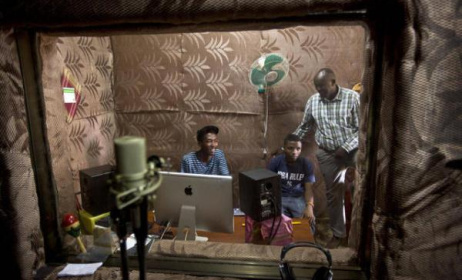Students talk to school Director Jean Claude Nkulikiyimfura as they practice in the music recording studio Source:www.m.deser